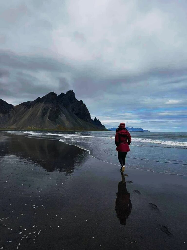 Image of a woman walking on a beach